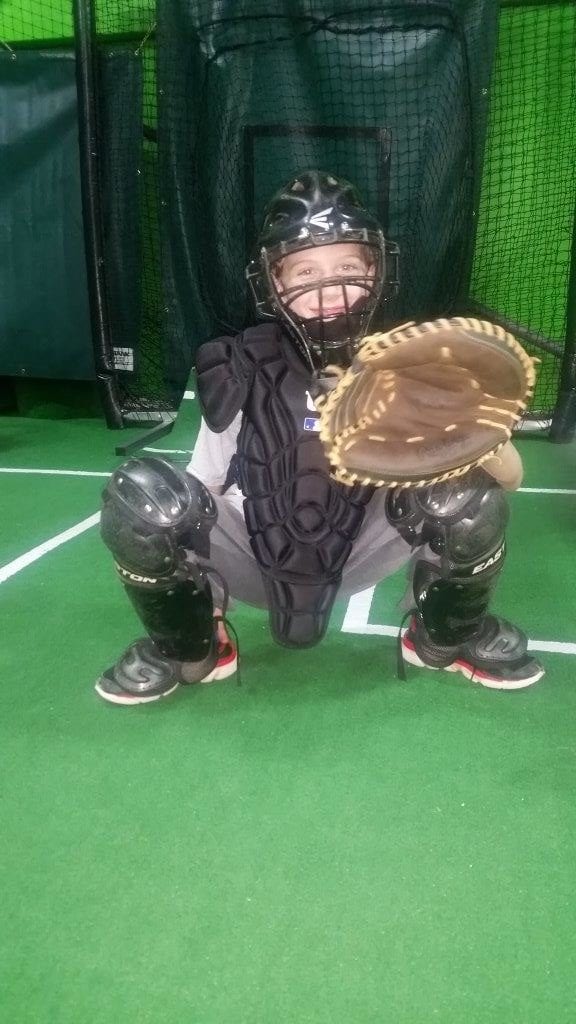 A catcher in the middle of a baseball game.