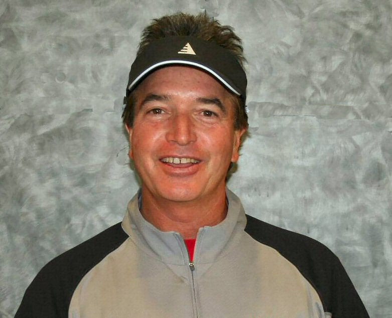 A man wearing a hat and jacket.
