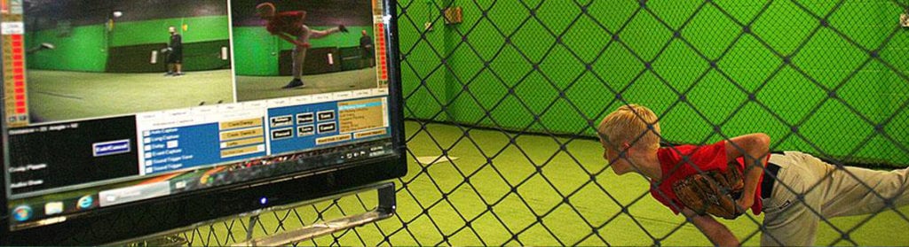 A television screen with a green wall behind it.