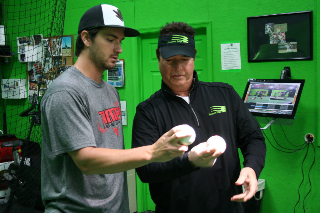 Two men are holding balls in their hands.