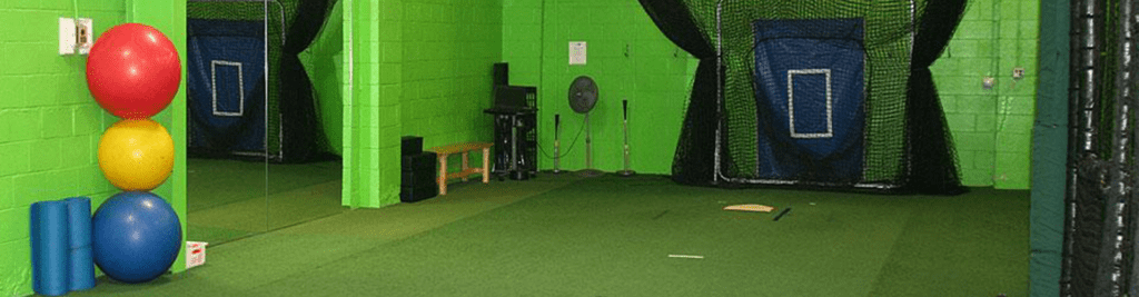 A green room with a bench and chair
