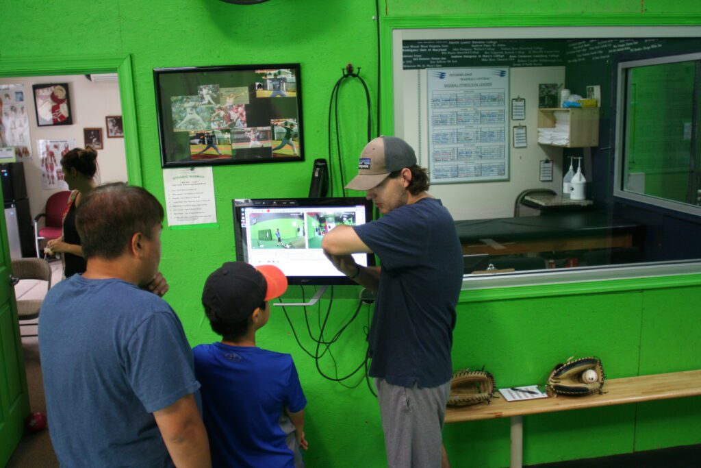 A man is pointing to something on the screen