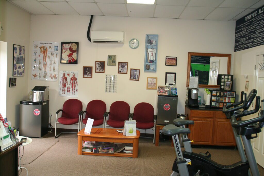 A room with several chairs and a table