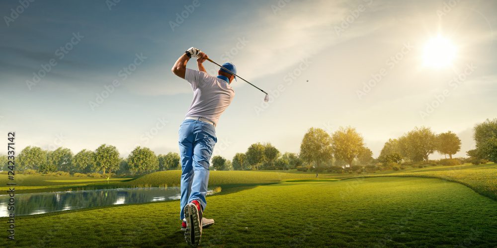 A man riding on the back of a bicycle while holding onto a golf club.